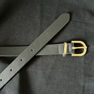 Small black false leather belt, gold detail